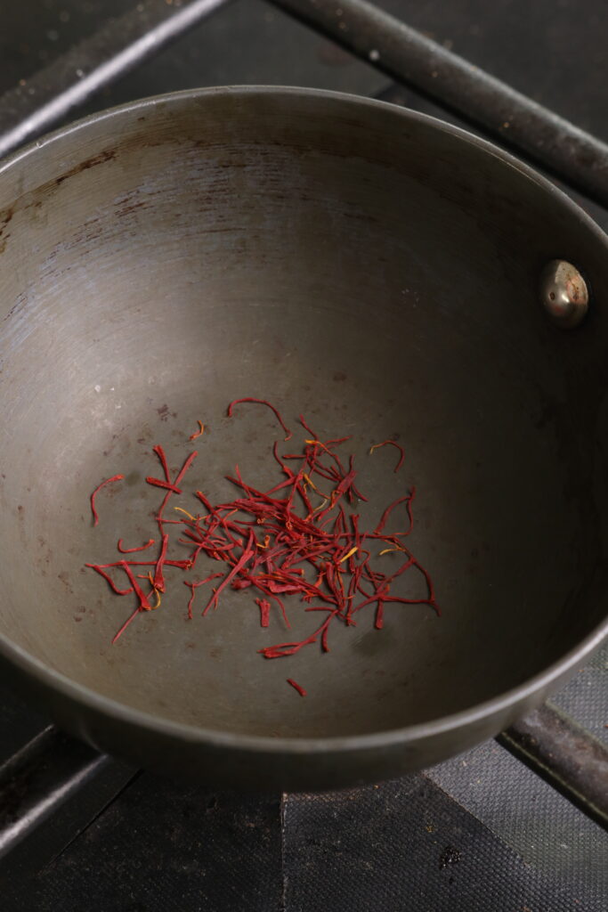 saffron toasting in a small pan