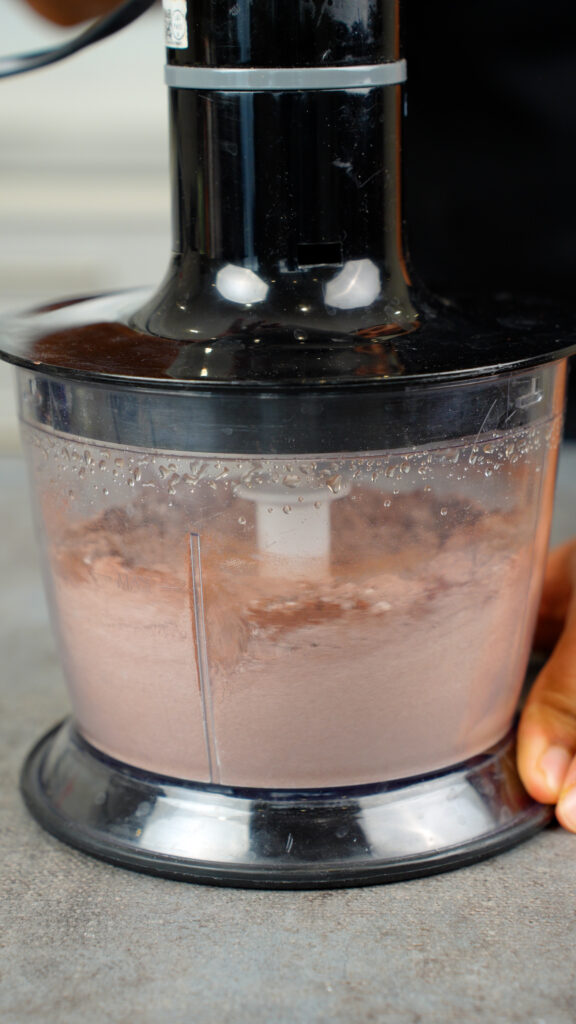 mixing flour, cocoa powder, sugar, and salt in a food processor