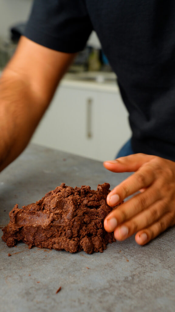 placing chocolate pastry dough on the counter