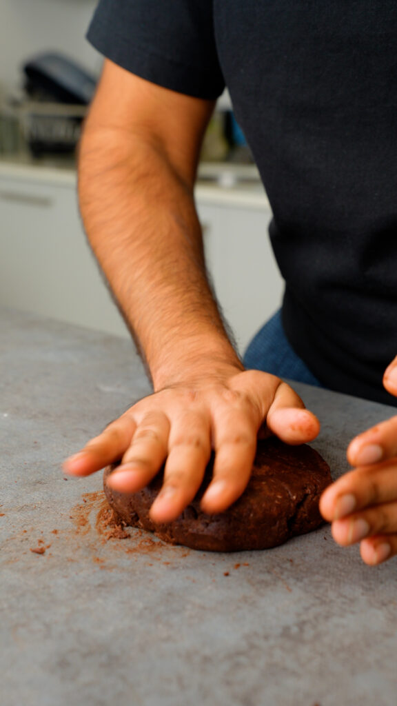 pressing the chocolate pastry dough into a disc