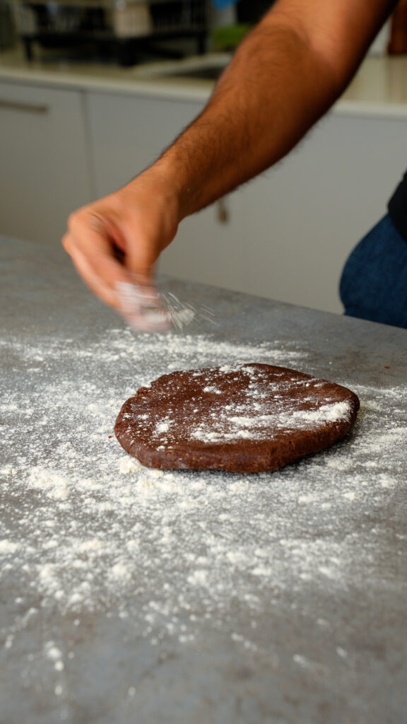 flouring rested pastry dough and counter