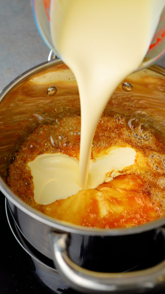 pour cream into caramel