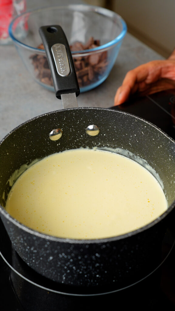 heat double cream or heavy cream in a saucepan