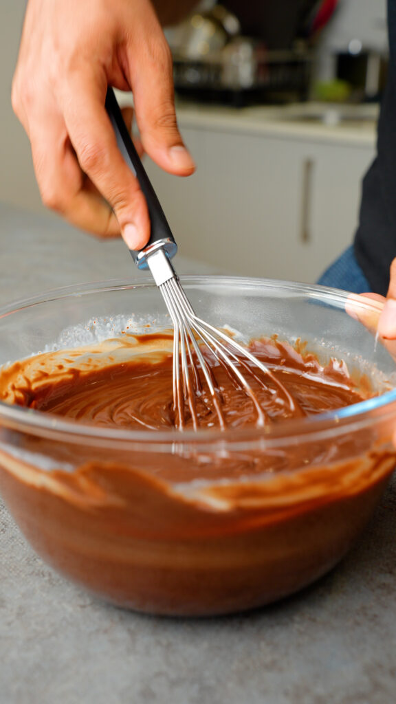 whisking chocolate ganache