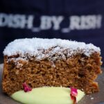 egg free Masala chai cake in a plate with cardamom custard