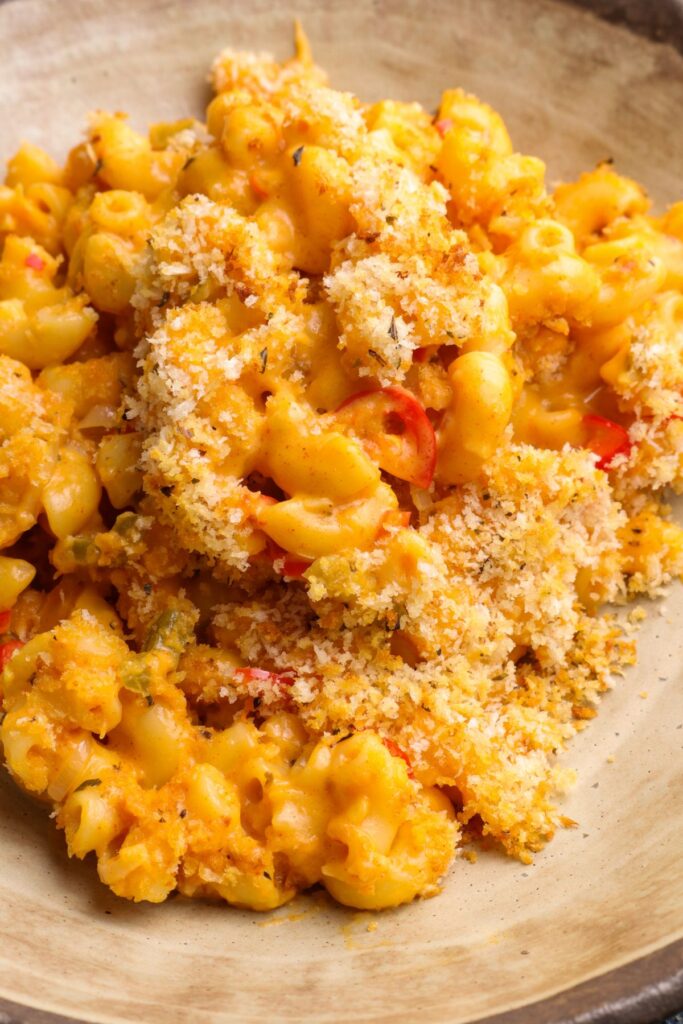 mac and chilli cheese in a bowl with breadcrumbs on top