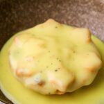 Cardamom custard poured on a mince pie