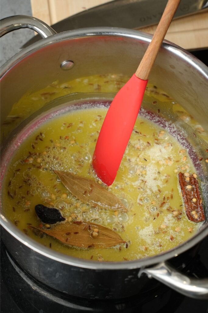 tempering spices in a saucepan