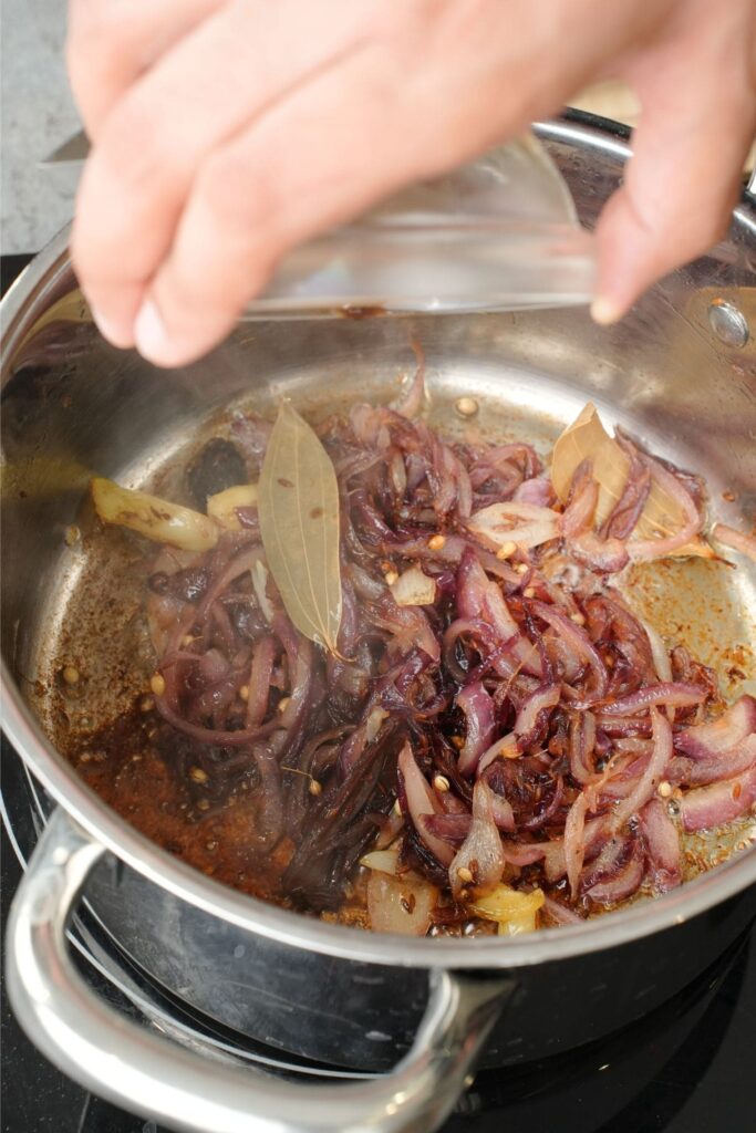 caramelising onions in a saucepan for gravy