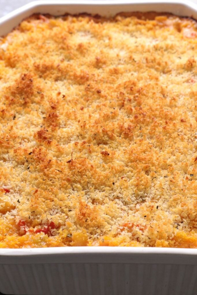 Baked mac and cheese with breadcrumbs in an oven tray