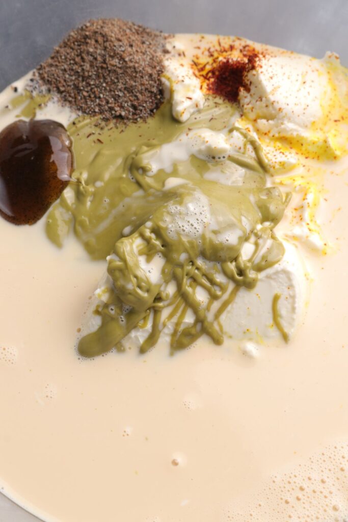 pistachio cream, cream cheese, evaporated milk in a mixing bowl