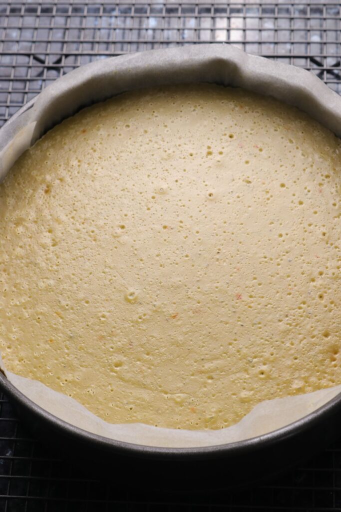 baked pistachio cheesecake cooling on a wire rack