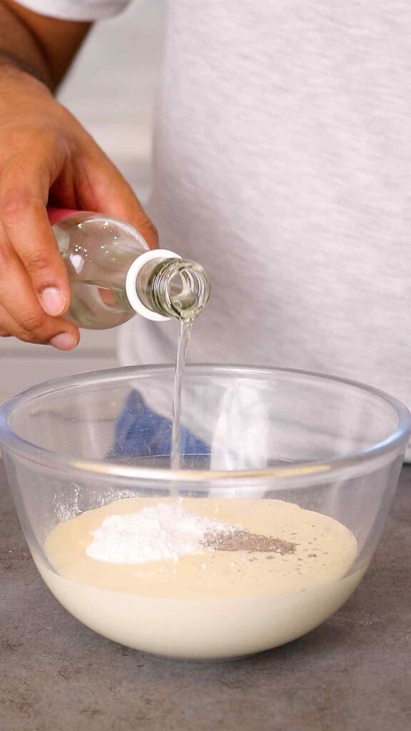 whipped cream ingredients in a mixing bowl