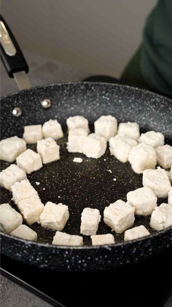 tofu being pan fried in oil