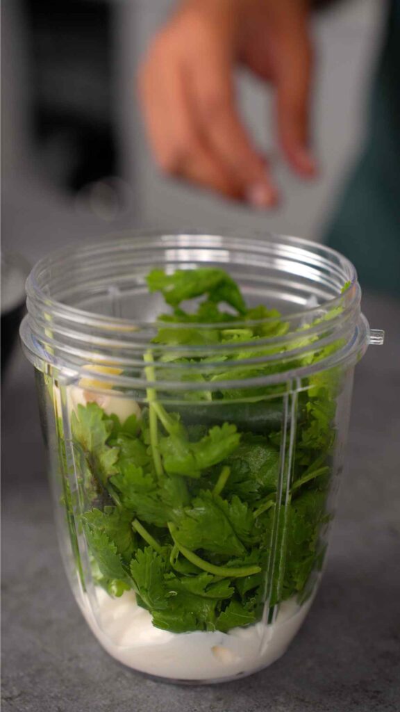mayonnaise, coriander, garlic, and green chillies in a blender jug