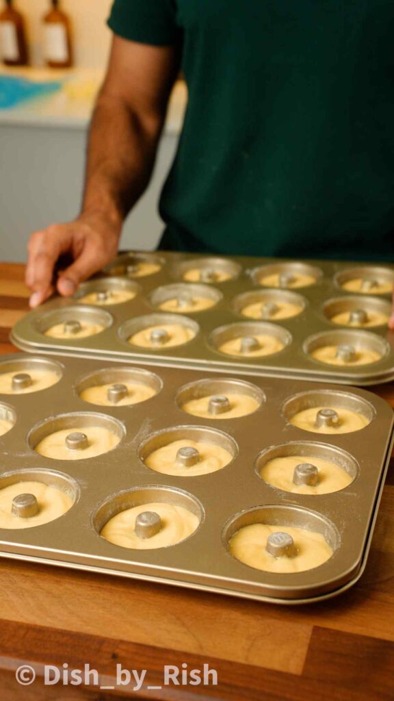 doughnut batter inside doughnut trays