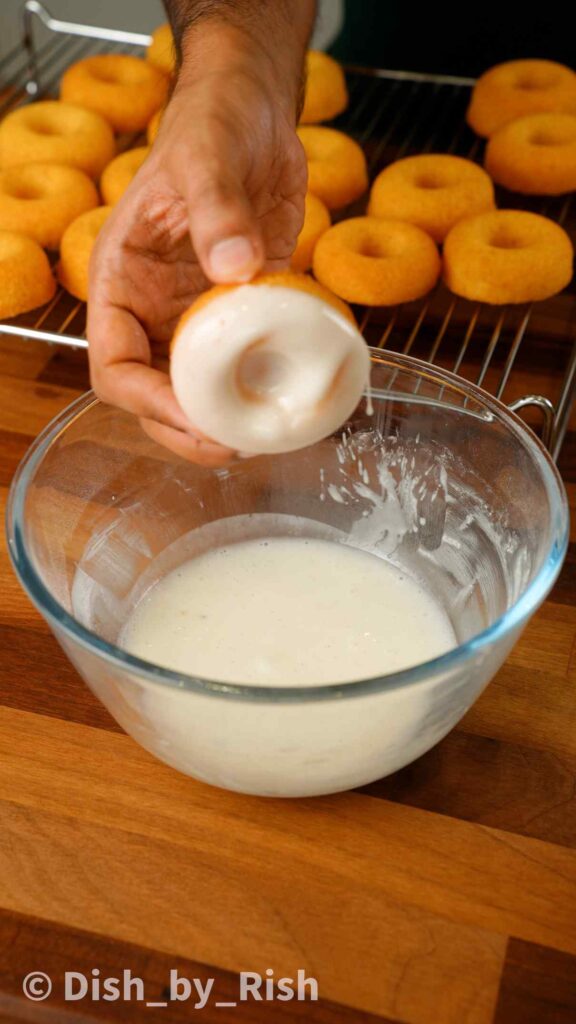 dunking doughnuts in a classic glaze