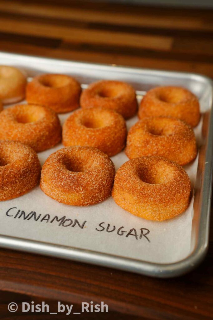 cinnamon sugar baked doughnuts on a tray