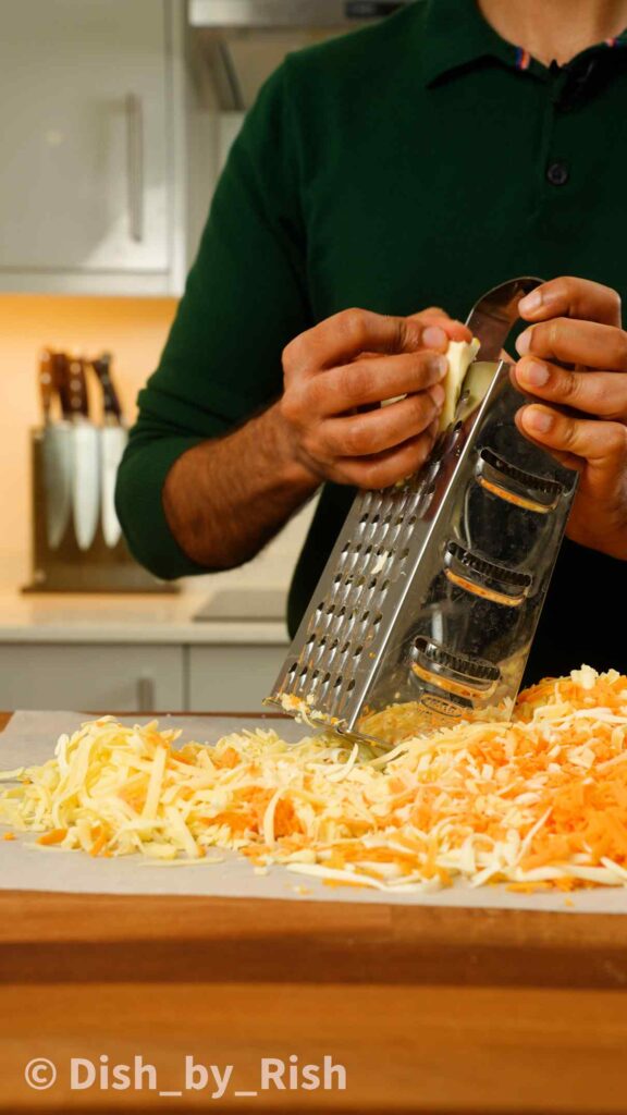 shredding cheeses on a box grater