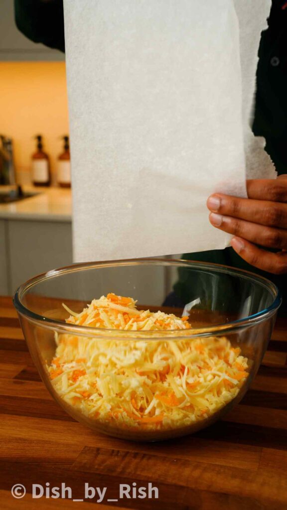 shredded cheeses in a mixing bowl