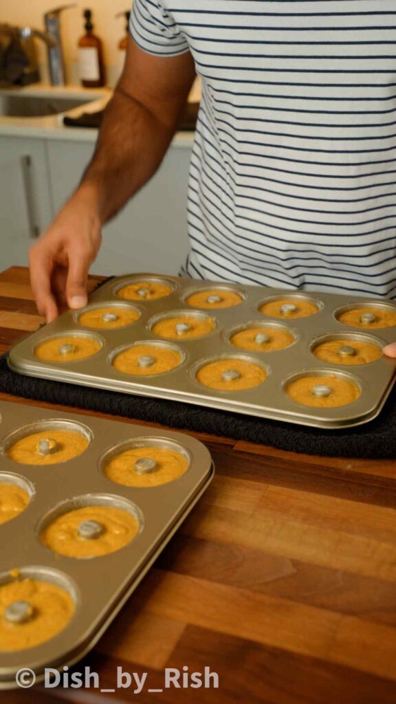 pumpkin doughnut trays filled with pumpkin doughnut batter