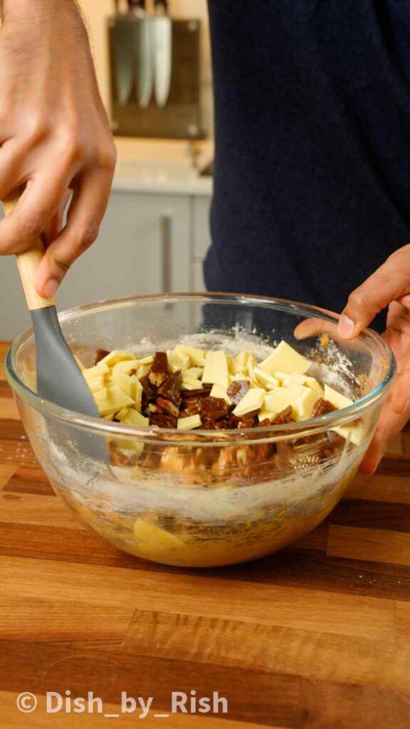 folding in the toffee, pecans, and white chocolate