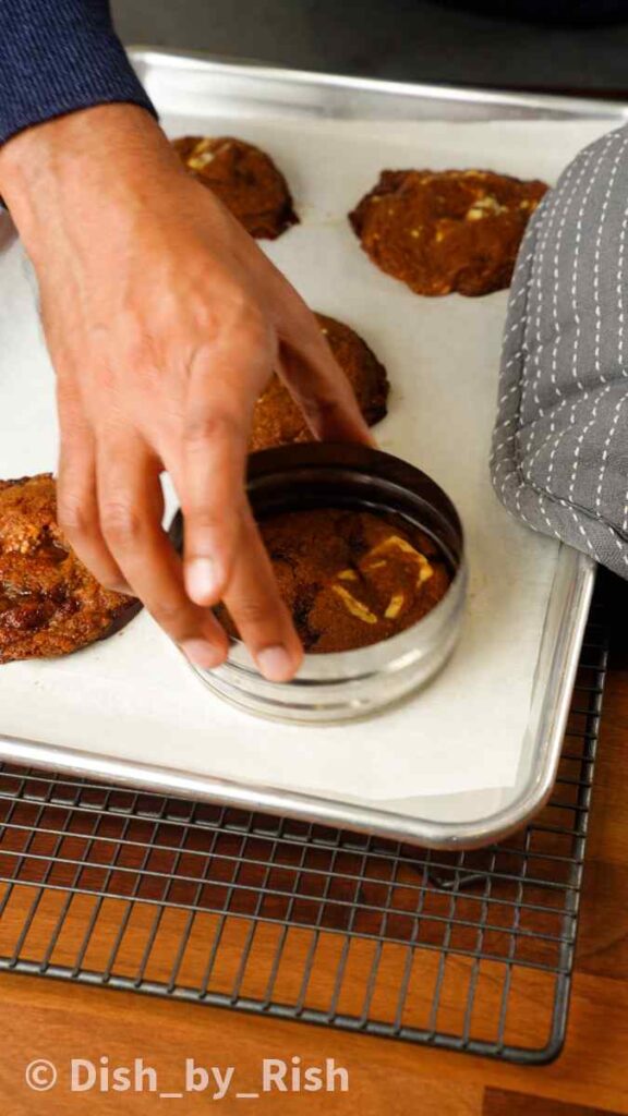 shaping baked cookies with cookie cutter