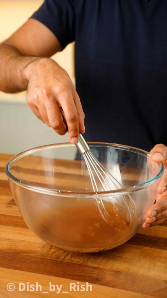 whisking cocoa and hot water
