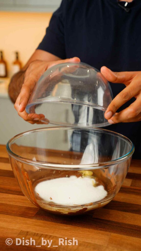 pouring sugar into mixing bowl