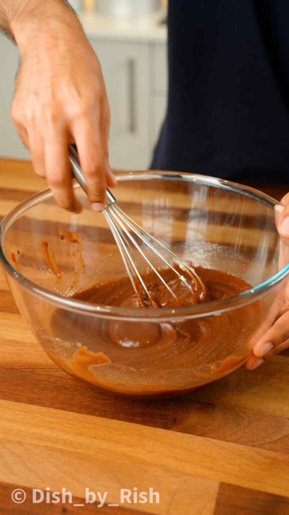 whisking wet mix together in a mixing bowl