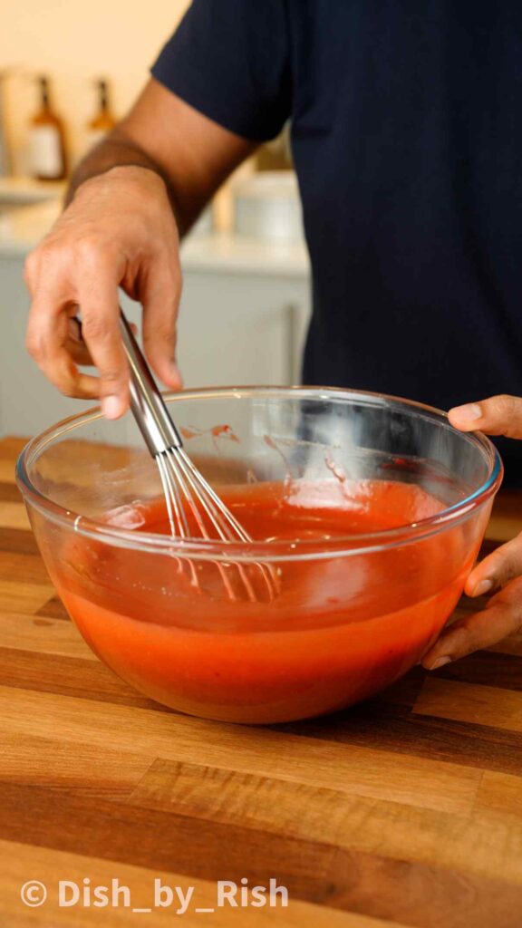 whisking red velvet cake wet mix