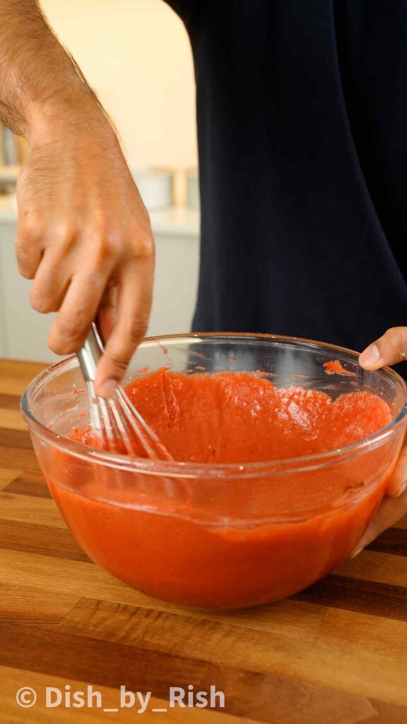 whisking red velvet cake wet mix