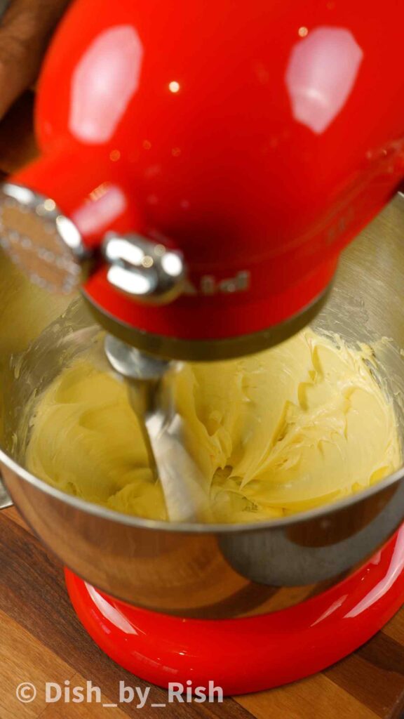 whisking butter with a paddle attachment in a stand mixer