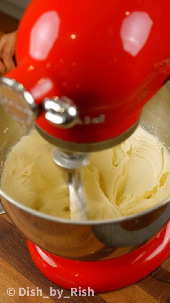 whisking butter with a paddle attachment in a stand mixer