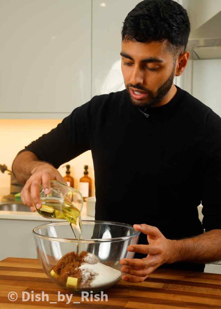 butter oil and sugars in a mixing bowl