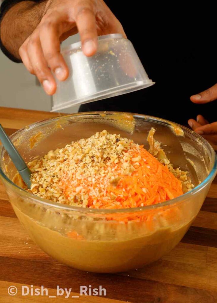 adding in carrots and walnuts