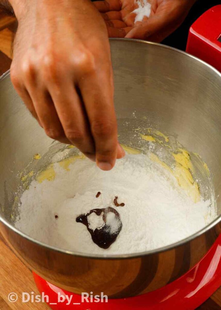 adding powdered sugar, vanilla, and salt