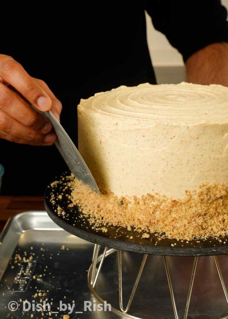 ground walnuts added to the sides of the carrot cake