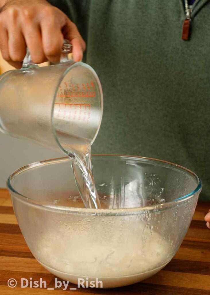 pouring water over poolish