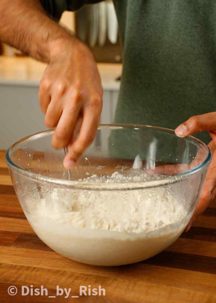 mixing in flour to poolish and water