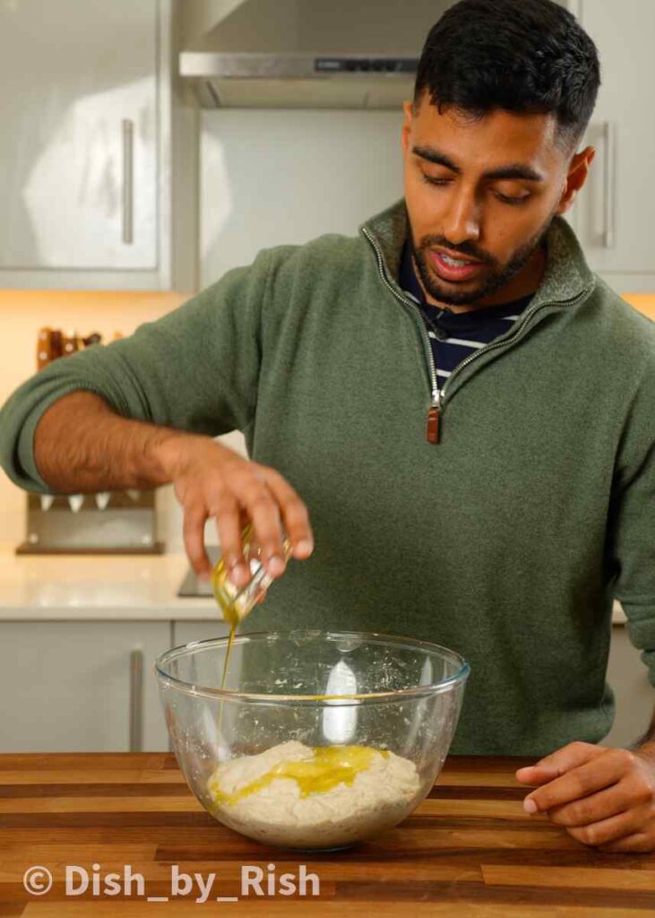 pouring oil and salt into mixing bowl