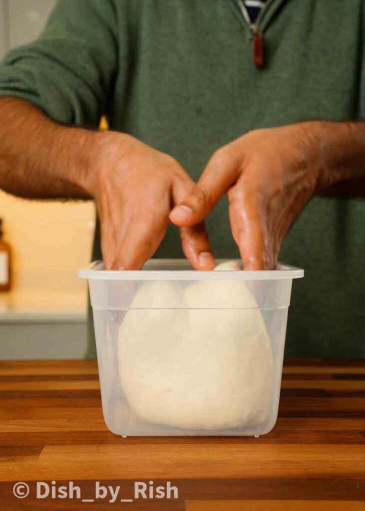 putting dough into container