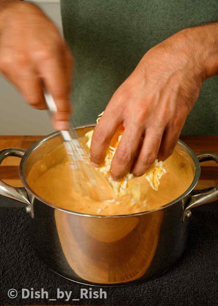 adding in grated cheese