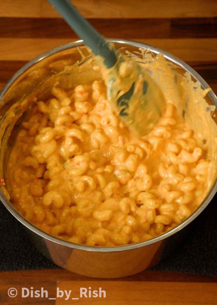 stirring in cooked pasta