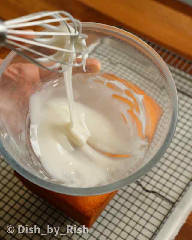 lemon glaze being whisked in a mixing bowl