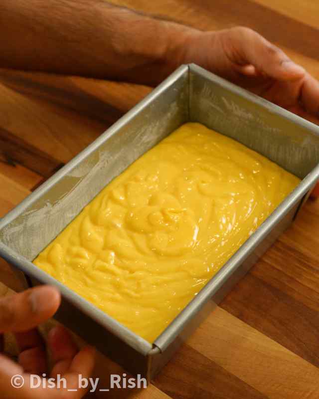 lemon drizzle cake batter poured into a loaf tin